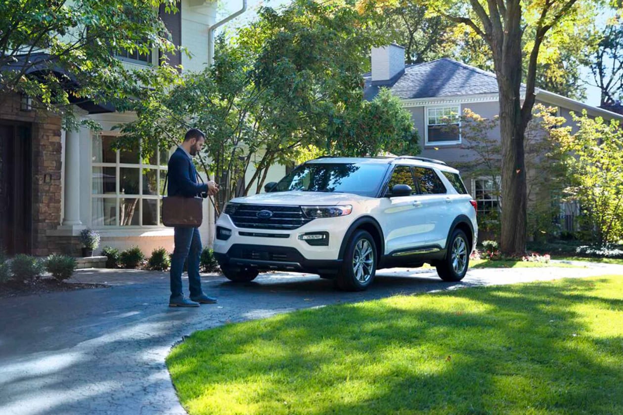 Driver approaching a parked Ford Explorer