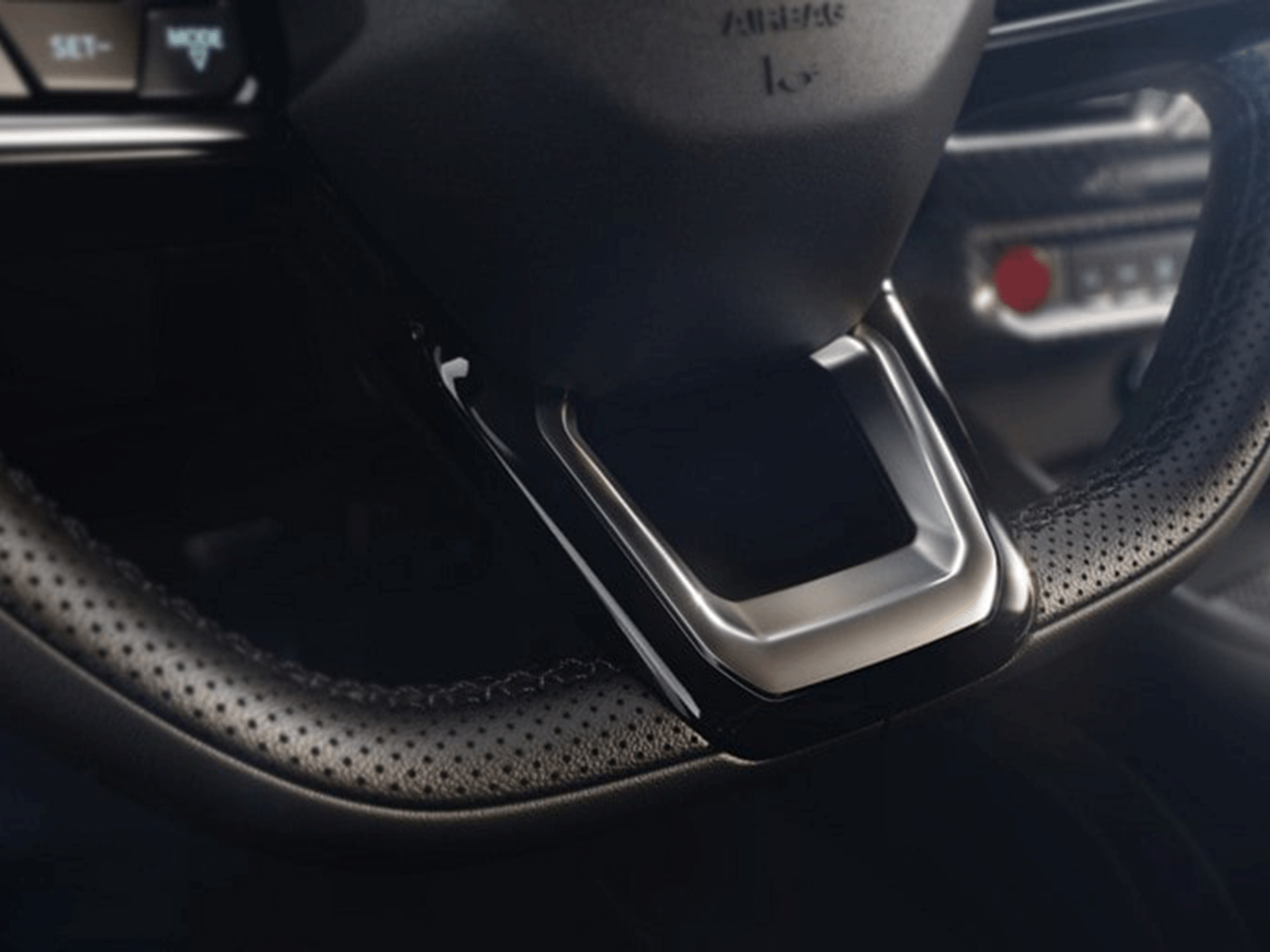 Driver behind the wheel of a 2024 Mustang